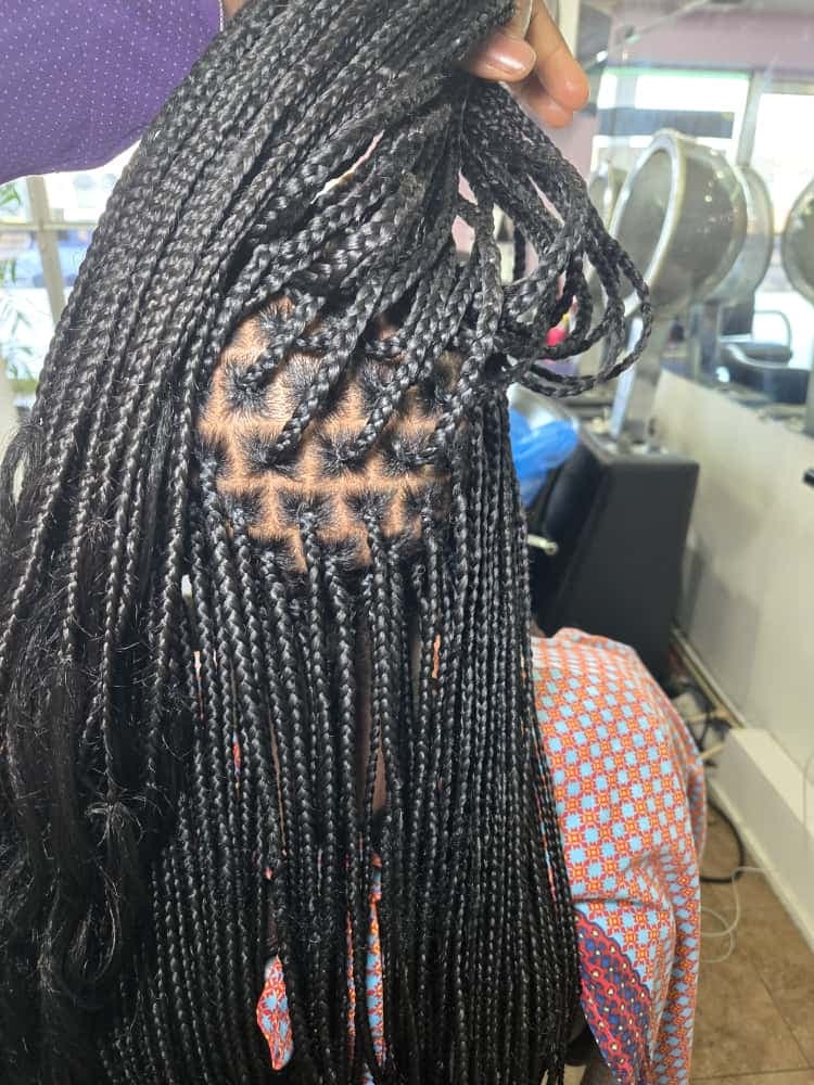 Box braids styled at Akwaba Hair Braiding