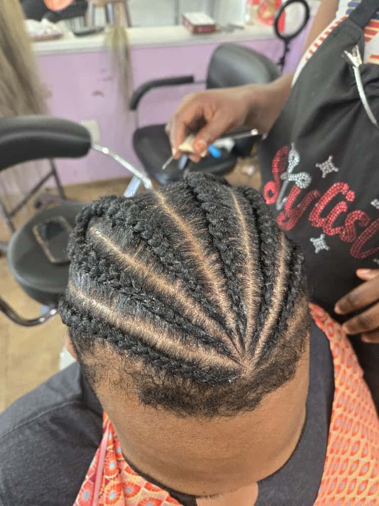 Men's cornrows by Akwaba Hair Braiding