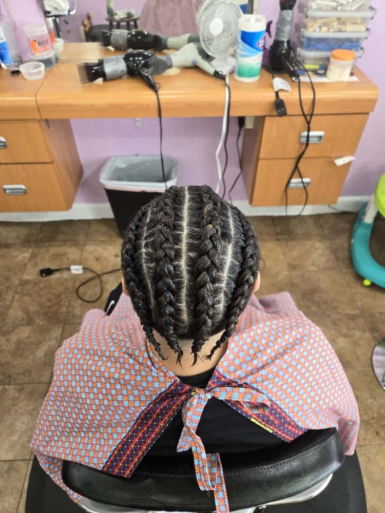 Men's cornrows by Akwaba Hair Braiding