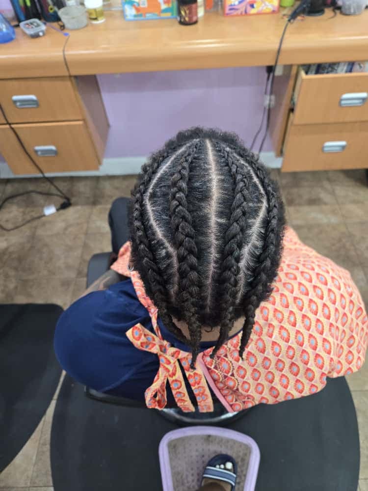 Men's cornrows by Akwaba Hair Braiding