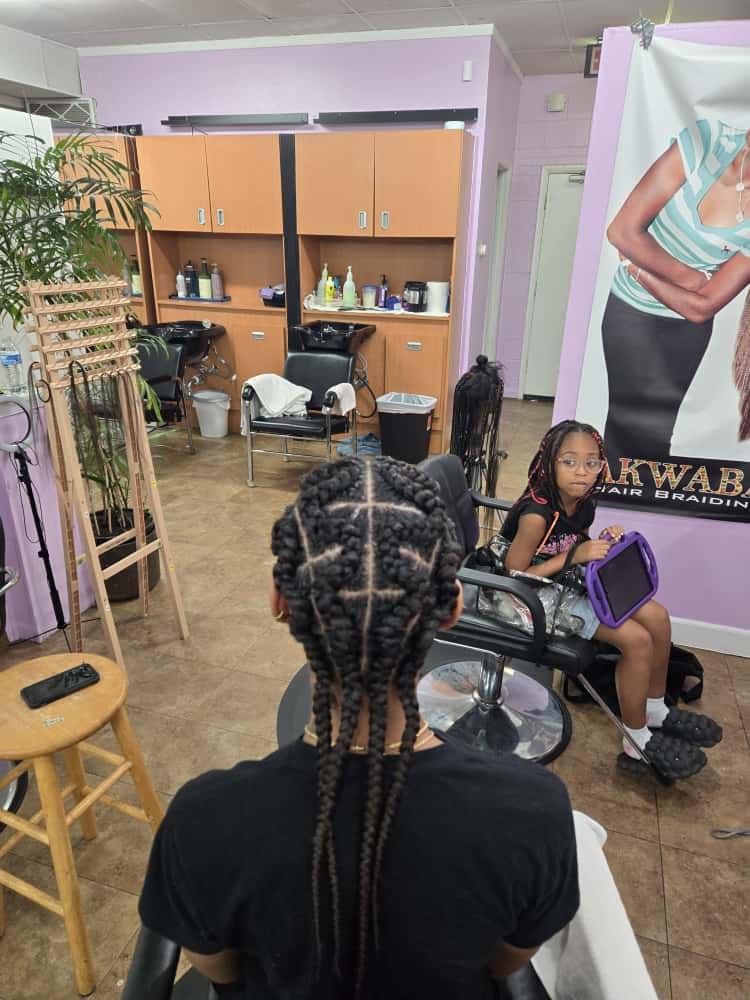 Women's cornrows by Akwaba Hair Braiding