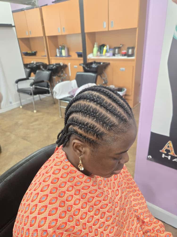 Women's cornrows by Akwaba Hair Braiding