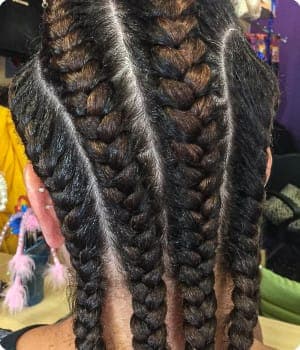 Women's cornrows by Akwaba Hair Braiding