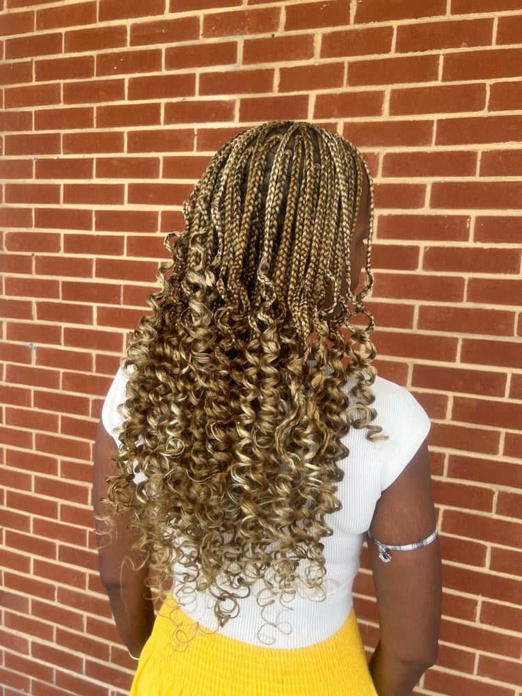 Women's box braids by Akwaba Hair Braiding