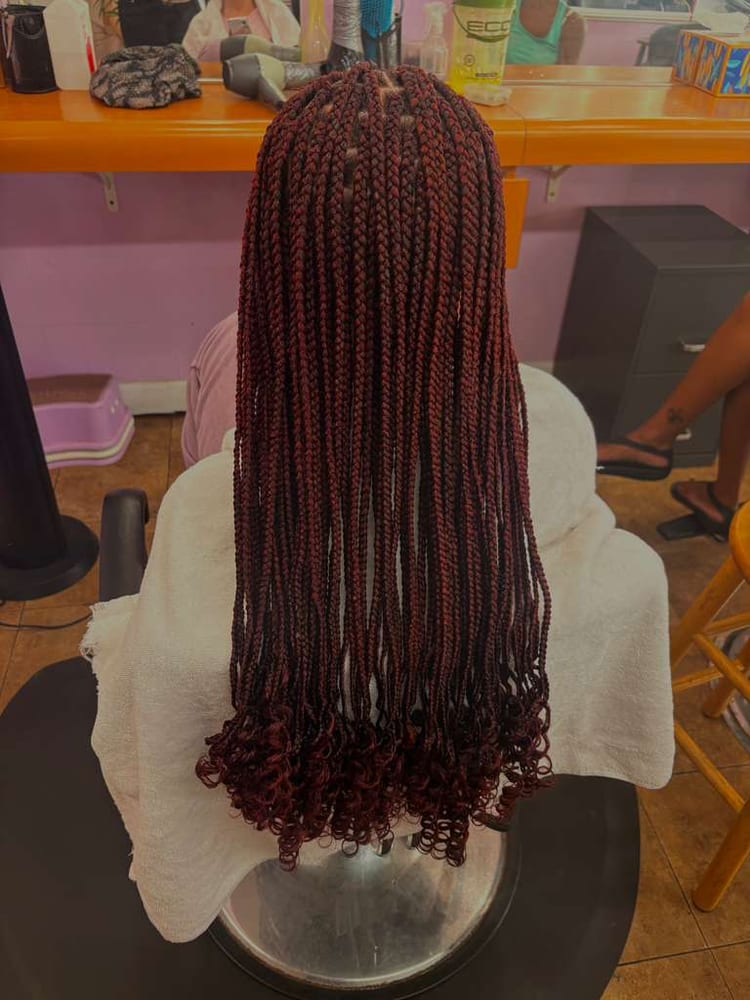 Women's box braids by Akwaba Hair Braiding