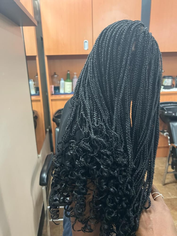 Women's box braids by Akwaba Hair Braiding