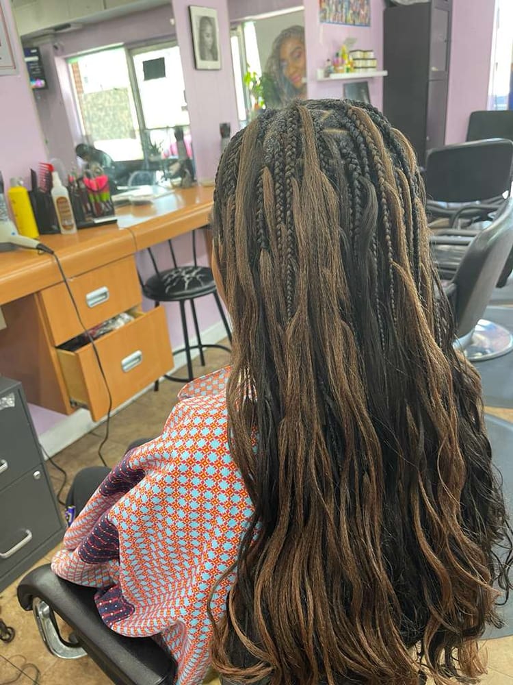 Women's french curl braids by Akwaba Hair Braiding