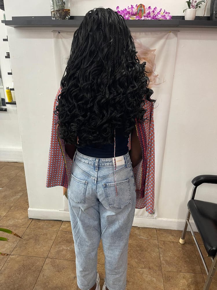 Women's french curl braids by Akwaba Hair Braiding