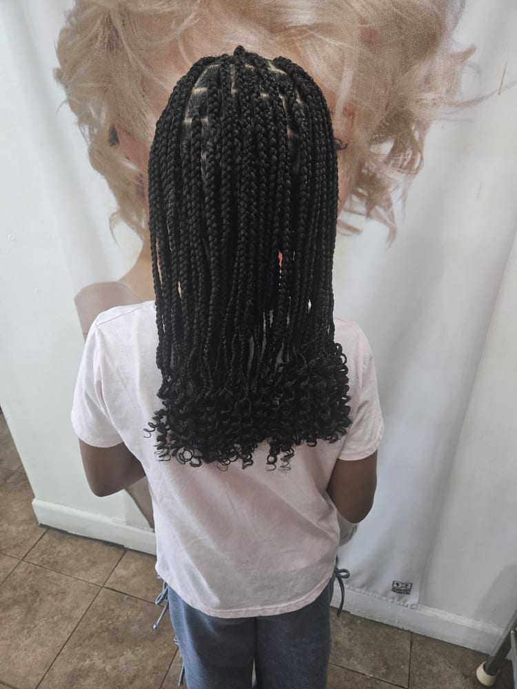 Kids' knotless braids by Akwaba Hair Braiding