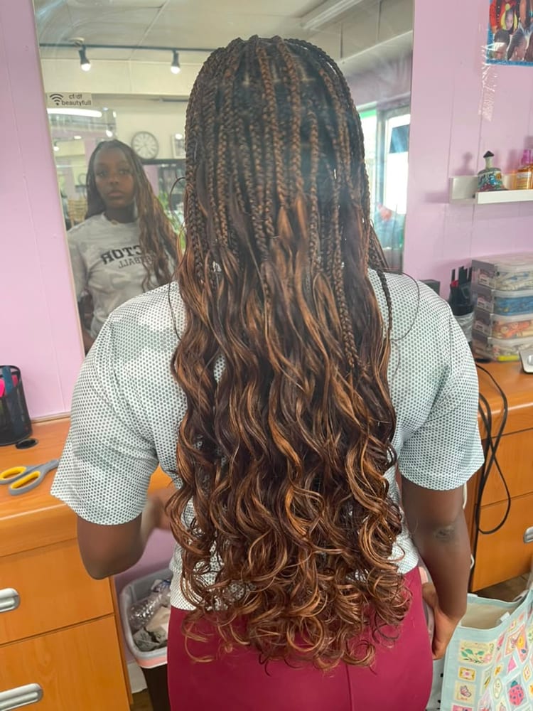 Women's french curl braids by Akwaba Hair Braiding