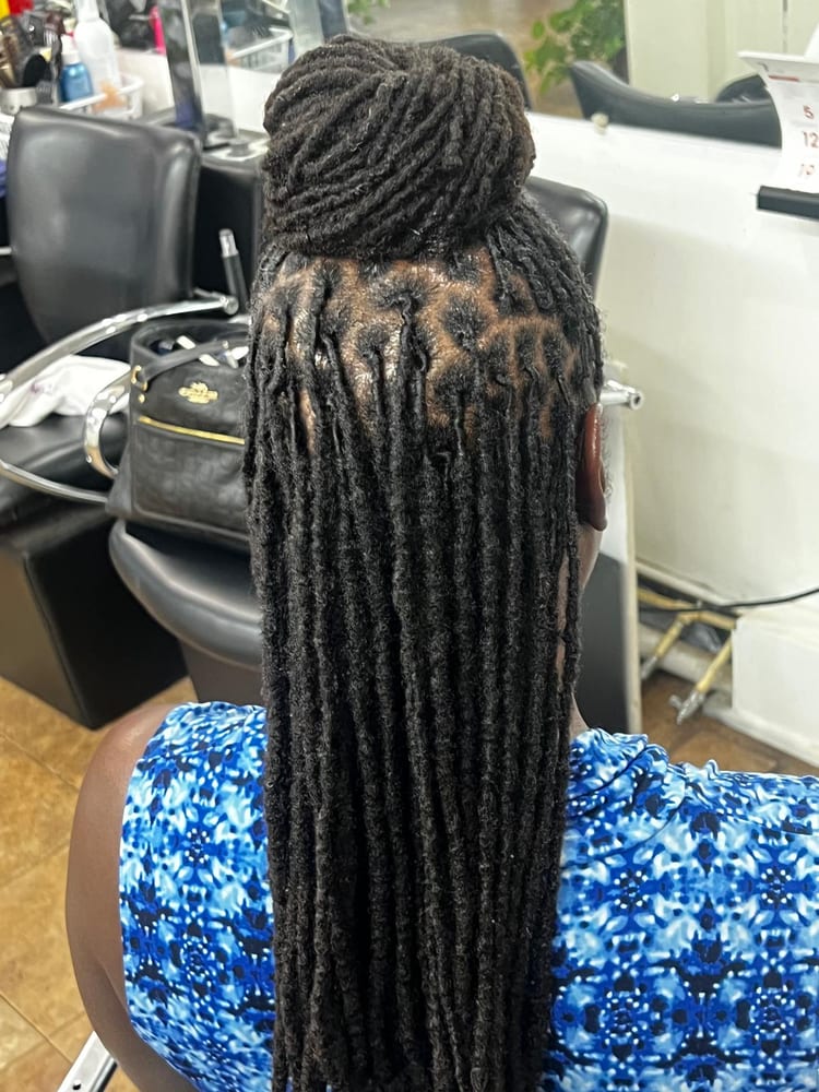 Women's locs by Akwaba Hair Braiding