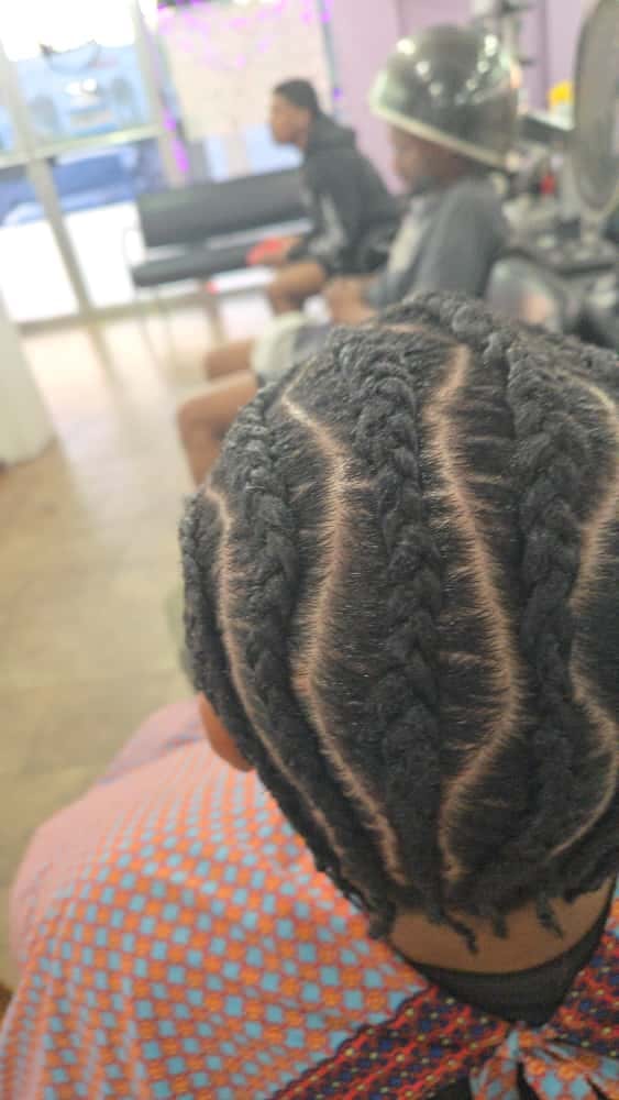 Men's cornrows by Akwaba Hair Braiding