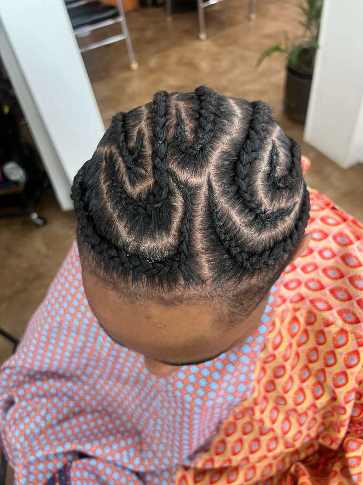 Men's cornrows by Akwaba Hair Braiding