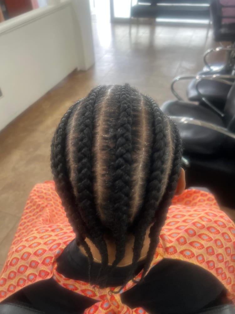 Men's cornrows by Akwaba Hair Braiding