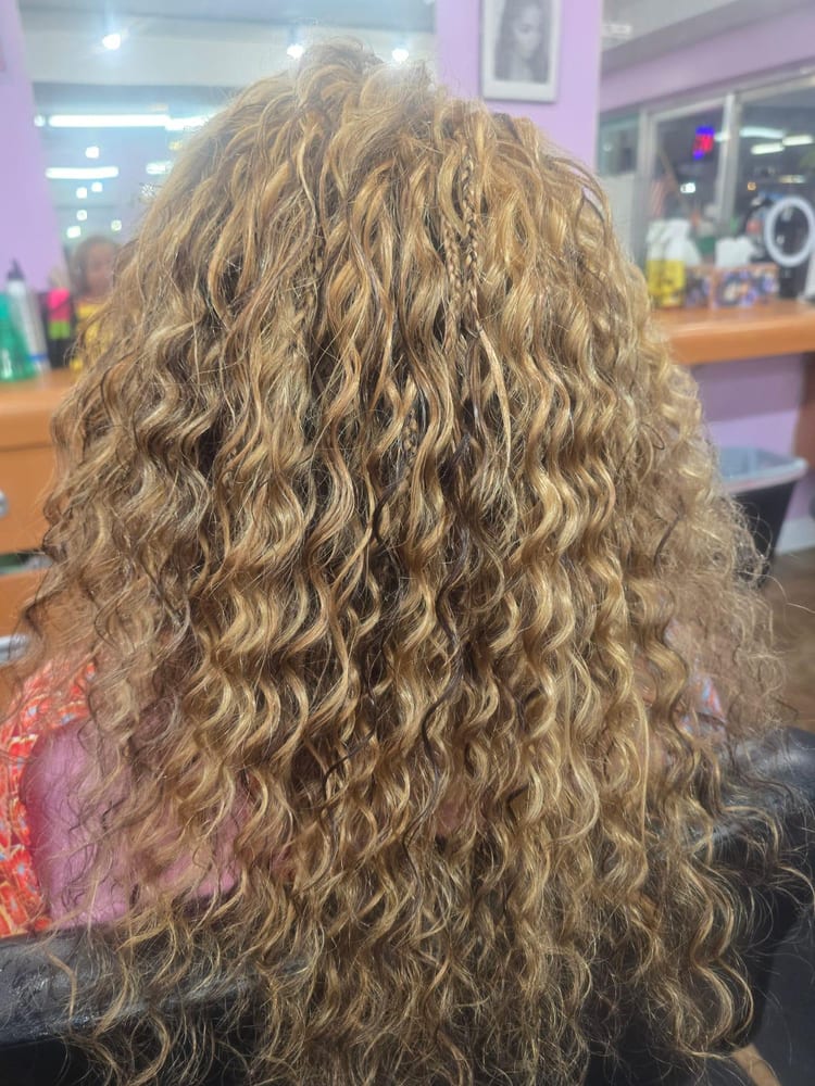 Women's micro braids by Akwaba Hair Braiding