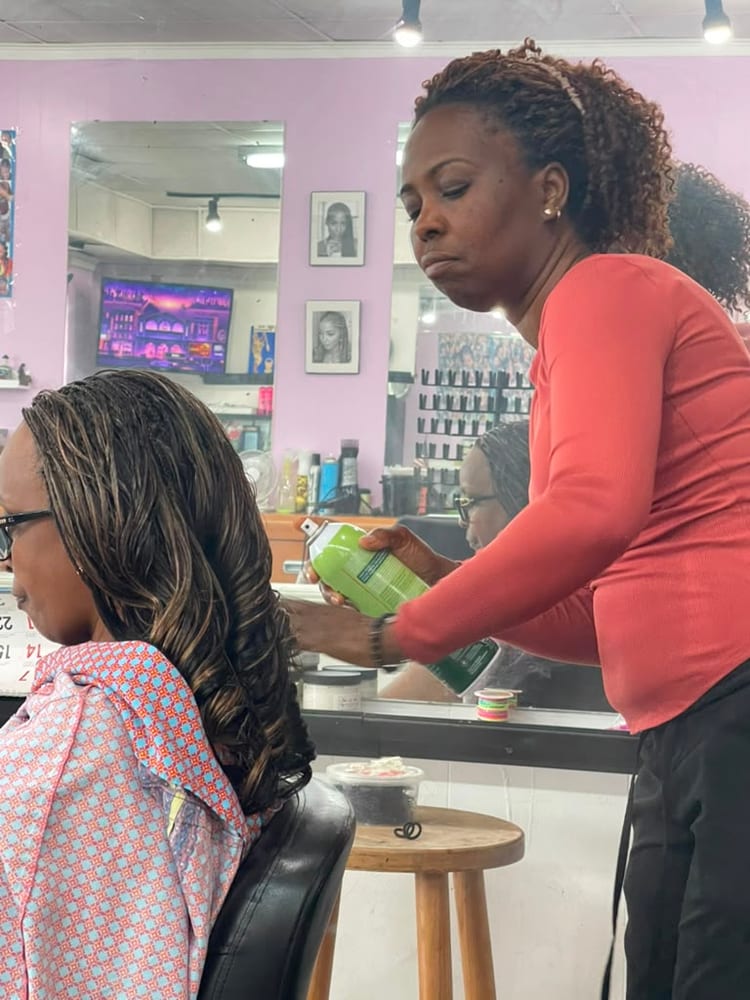 Women's boho knotless braids by Akwaba Hair Braiding