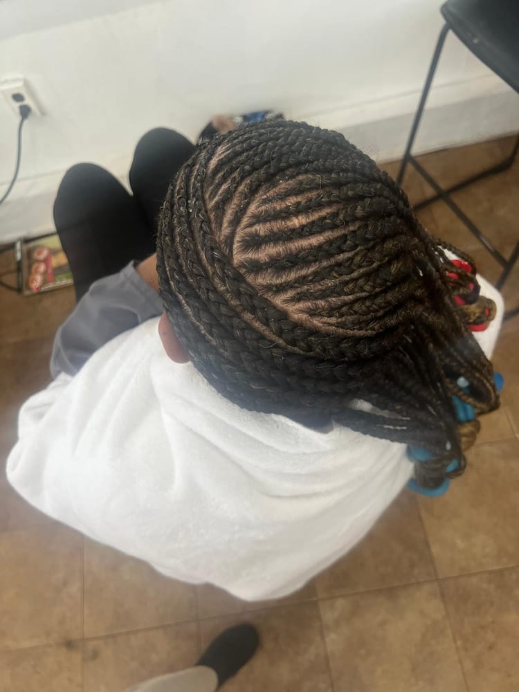 Women's cornrows by Akwaba Hair Braiding