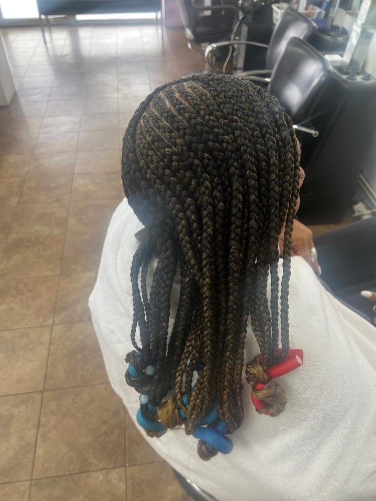 Women's cornrows by Akwaba Hair Braiding