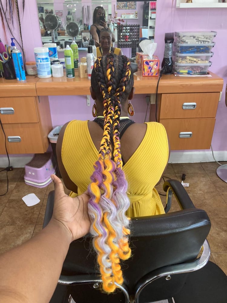 Women's cornrows by Akwaba Hair Braiding