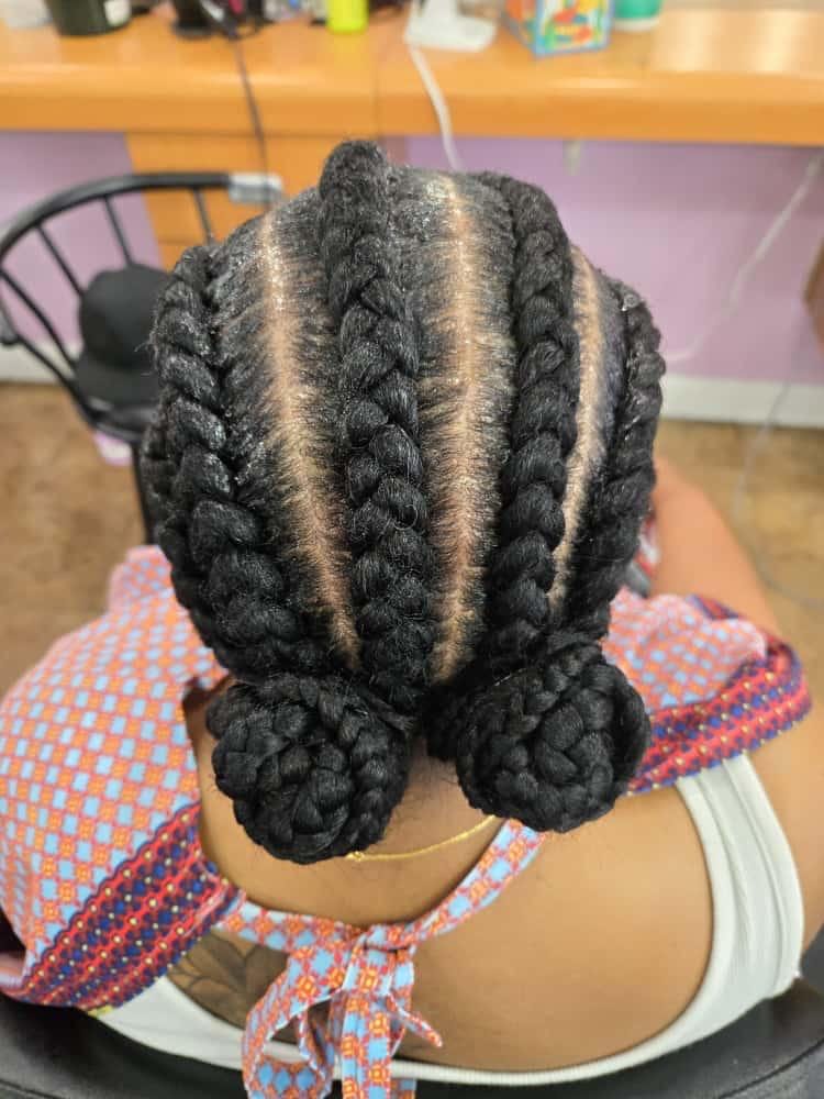 Women's cornrows by Akwaba Hair Braiding