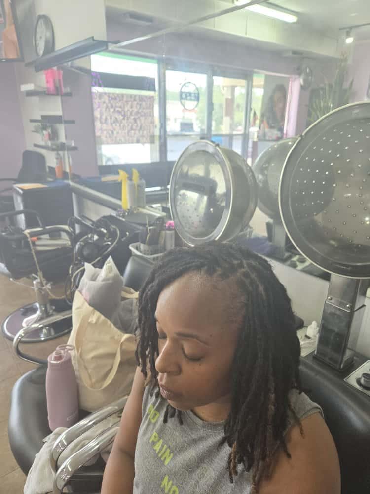 Women's locs by Akwaba Hair Braiding
